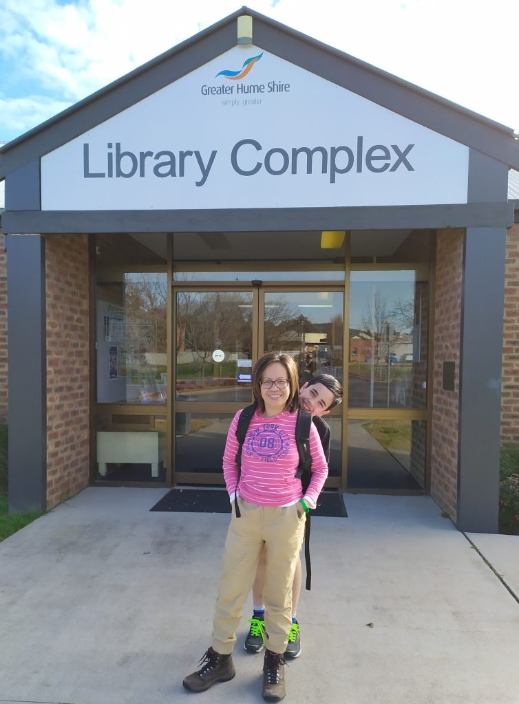mother and son visiting the library