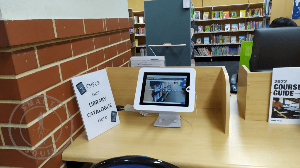 inside Barmera Public Library looking at a handheld computer on a desk