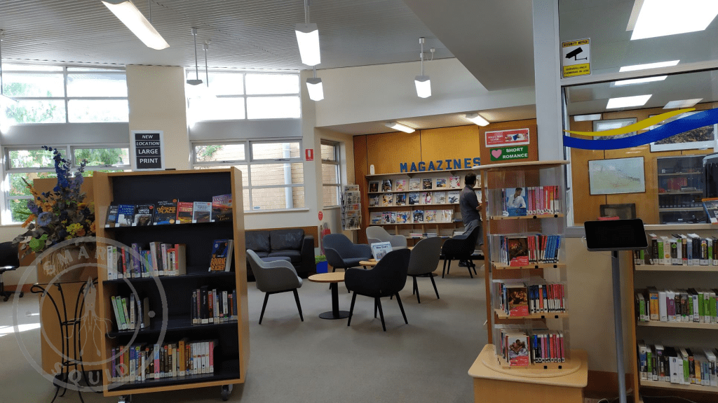 inside the Berri Library looking at shelves and chairs and tables