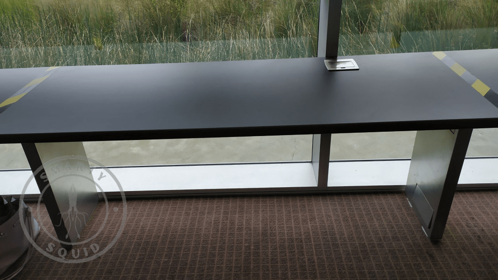 inside Victor Harbor Library looking at an empty grey desk 